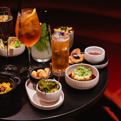 Cocktails and small plates served in a hospitality lounge